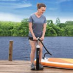 Bestway Air Hammer Sport 62227 inflating a stand-up paddleboard on a jetty