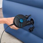 Bestway PowerTouch 62255 air pump held against an inflatable mattress valve