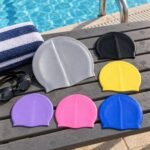 Conquest 100% Silicone Swimming Cap – Unisex - illustrative image, scene generated
