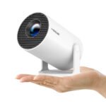 Magcubic HY300 Pro projector held in one hand, showing its size
