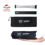 Naturehike FT08 folding table packed into its carry bag, held in one hand