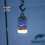 Naturehike NH22ZM005 mosquito killer lamp hanging from its hook at a campsite