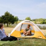 CORE 3 person dome tent pitched at a campsite at dusk