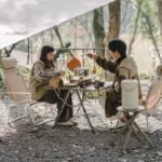 Naturehike Nest Creek folding table in use at a forest campsite